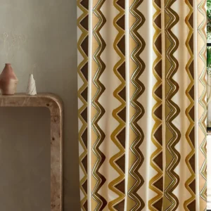 multicolour striped curtain with side table and vases