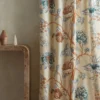brown botanical curtain with side table and vases