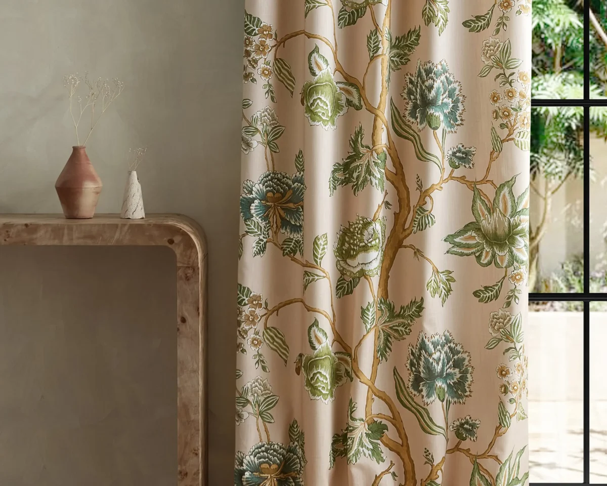 green botanical curtain with side table and vases