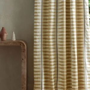 neutral striped curtain with side table and vases
