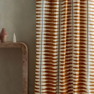 red striped curtain with side table and vases