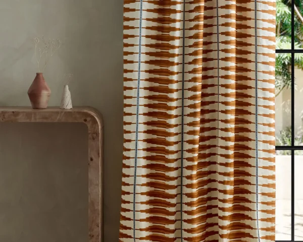Cintilla Fabric - Spice / Adriatic by red striped curtain with side table and vases