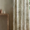 neutral botanical curtain with side table and vases