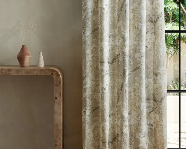 neutral botanical curtain with side table and vases