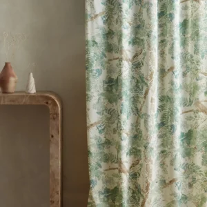 green botanical curtain with side table and vases