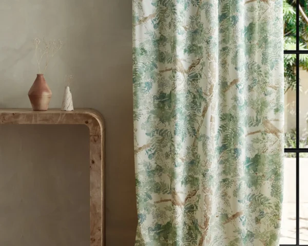 green botanical curtain with side table and vases