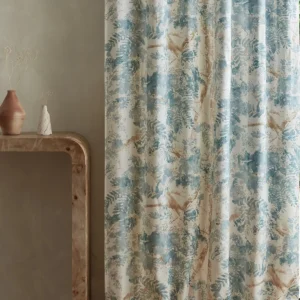 blue botanical curtain with side table and vases