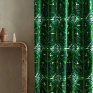 green geometric curtain with side table and vases