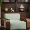 green striped armchair with plants and vases