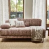 brown contemporary sofa with cushion and curtain