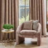 brown contemporary armchair with curtain and cushion