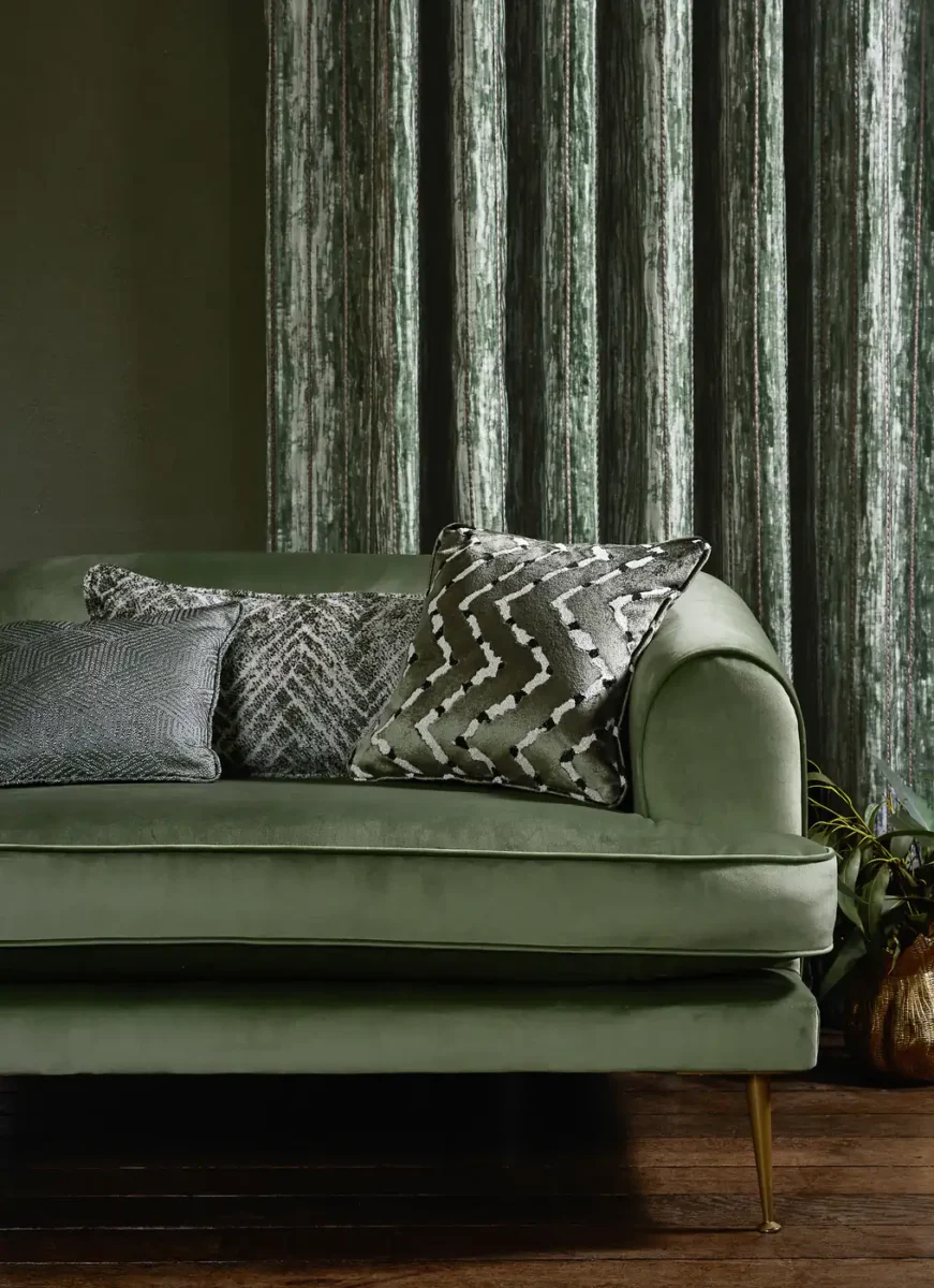 Trenzado Fabric - Grassland by red striped sofa with cushion and curtain