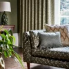 brown geometric sofa with cushion and lamps