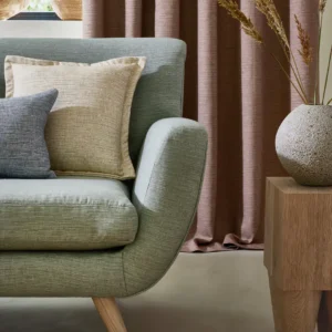 neutral plain sofa with curtain and cushion