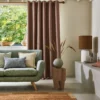 neutral plain sofa with curtain and cushion