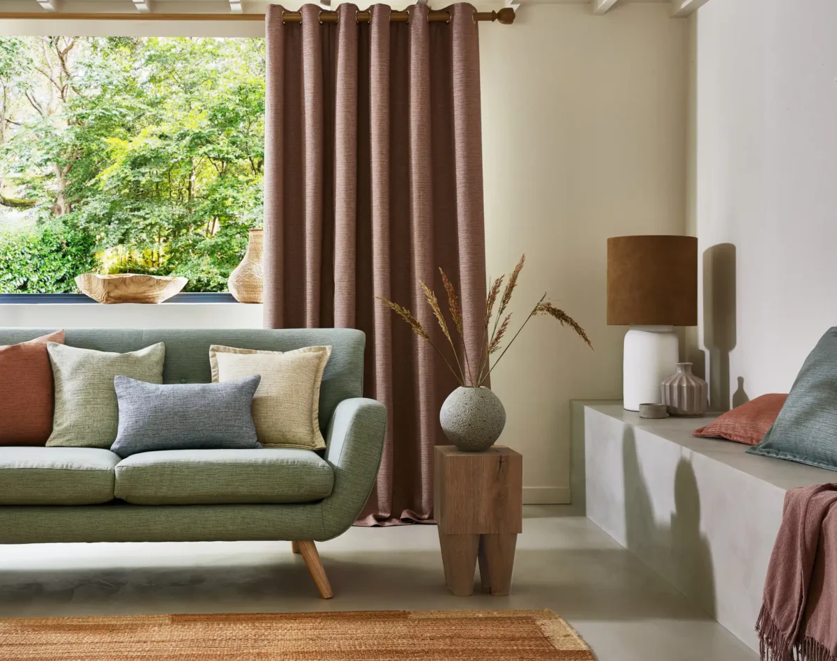 neutral plain sofa with curtain and cushion