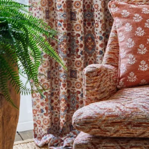 brown geometric armchair with cushion and curtain