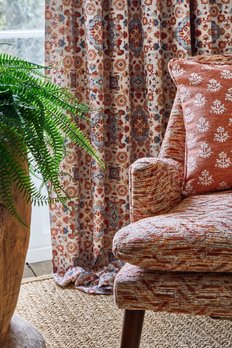 Zari Fabric - Tangerine by brown geometric armchair with cushion and curtain
