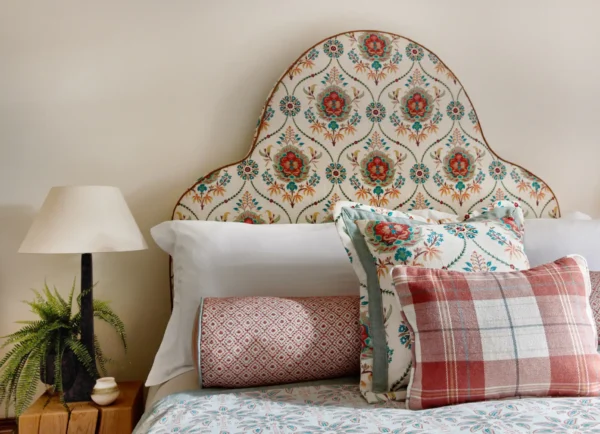 Leila Fabric - Oasis by green botanical bed with cushion and lamps
