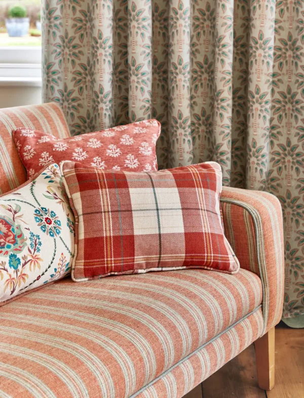 green checked sofa with cushion and curtain
