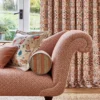 green geometric sofa with cushion and curtain