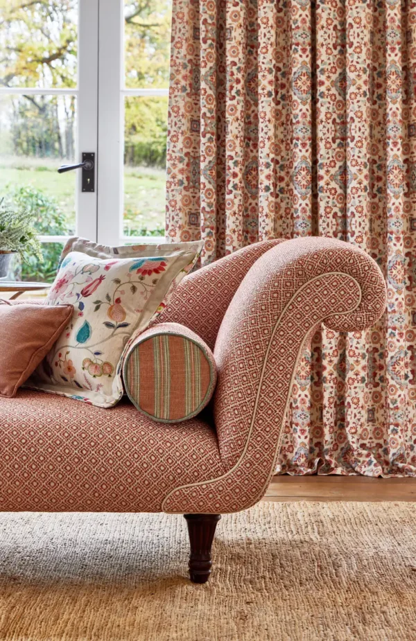 Sadira Fabric - Lotus by green geometric sofa with cushion and curtain