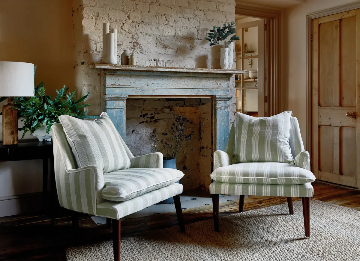 black-grey striped armchair with lamps and plants