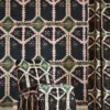 Brocha Fabric from Harlequin Zamora Wallpapers collection - green geometric